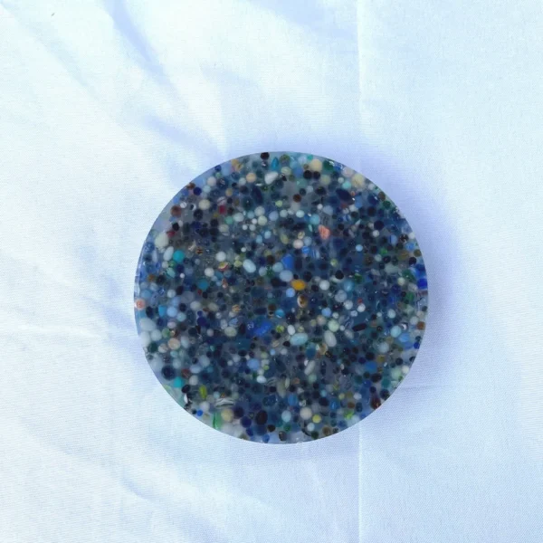 A handmade picky pad filled with various tumbled gemstones
