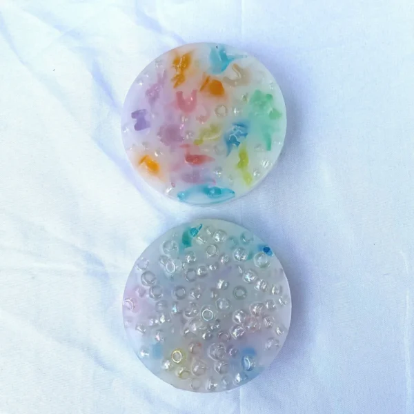 Two picky pads mad with multicolored miniature dinosaurs