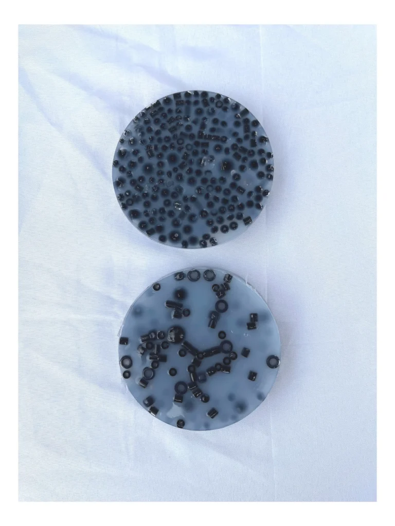 Two handmade picky pads made with all-black pebbles