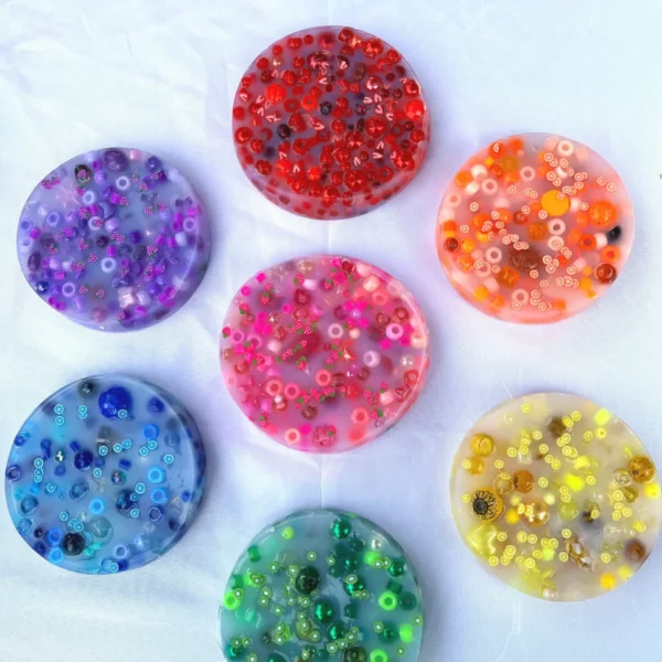7 picky pads, each made with a different vibrant group of colored assorted beads