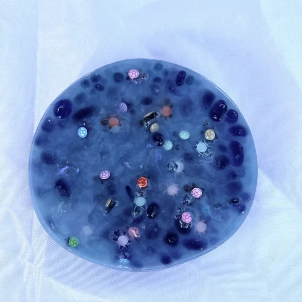 A blue picky pad containing pebbles