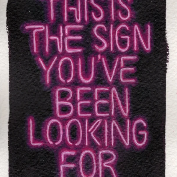 An art print of a neon-lit sign that says "This is the sign you've been looking for"