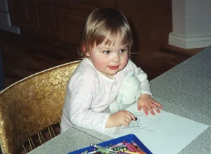 Elise Jackman as a toddler coloring on paper